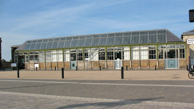 A one-storey building with a glass roof