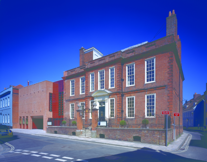 View of Pallant House Gallery, a red brick Georgian building with a modern extension