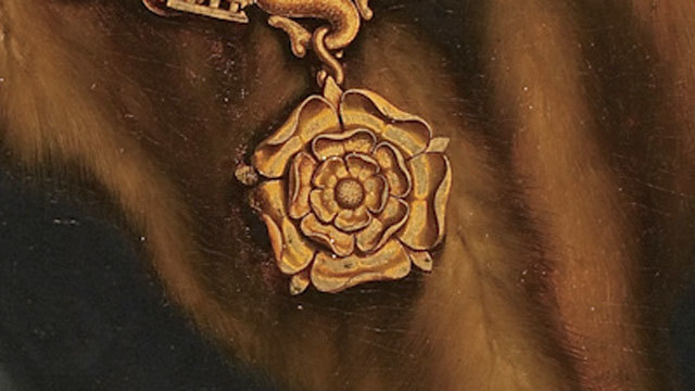 Image of an oil painting showing a close up of Tudor rose on a chain